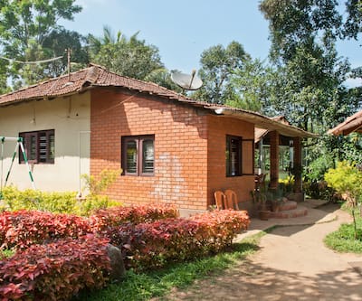 https://imgcld.yatra.com/ytimages/image/upload/t_hotel_yatra_city_desktop/v1391159874/Domestic Hotels/Hotels_Coorg/Hotel Prashanti Resort/Facade3~36.jpg